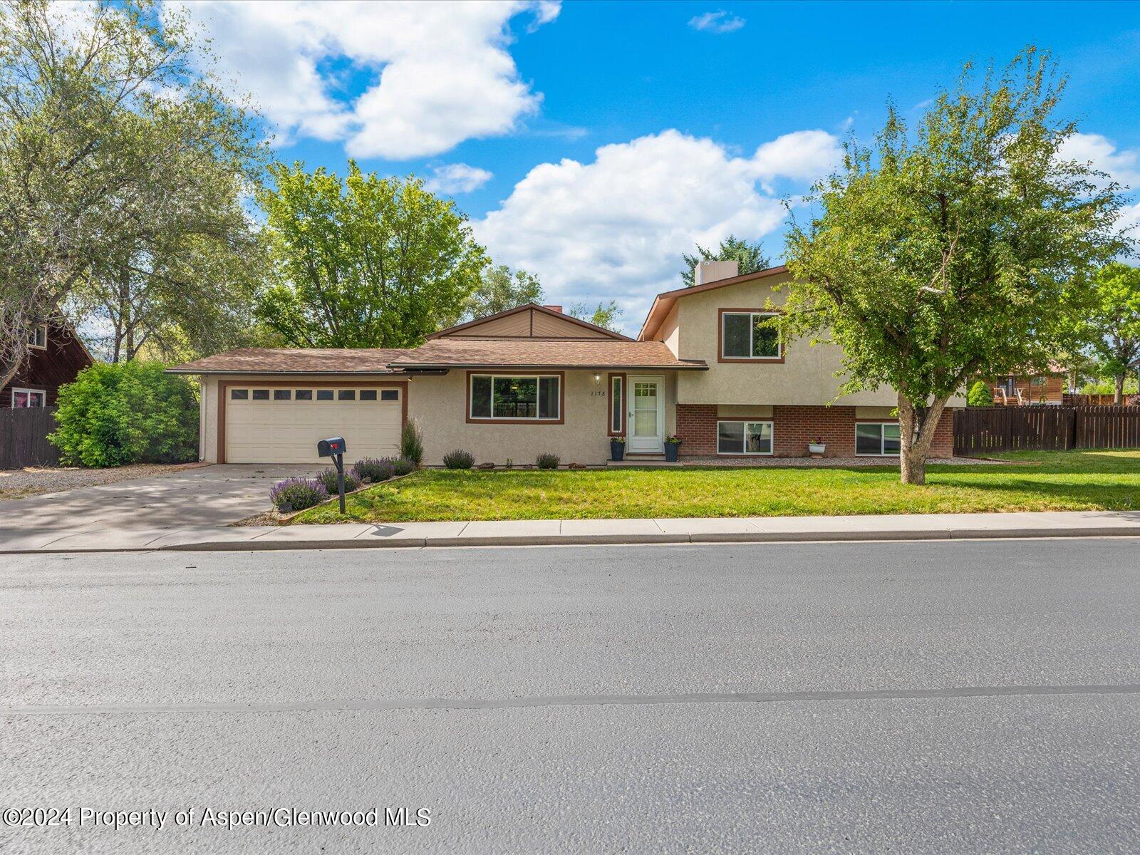 1178 East 8th Street Rifle, CO 81650 - Photo 1 of 28 a view of a house with a swimming pool