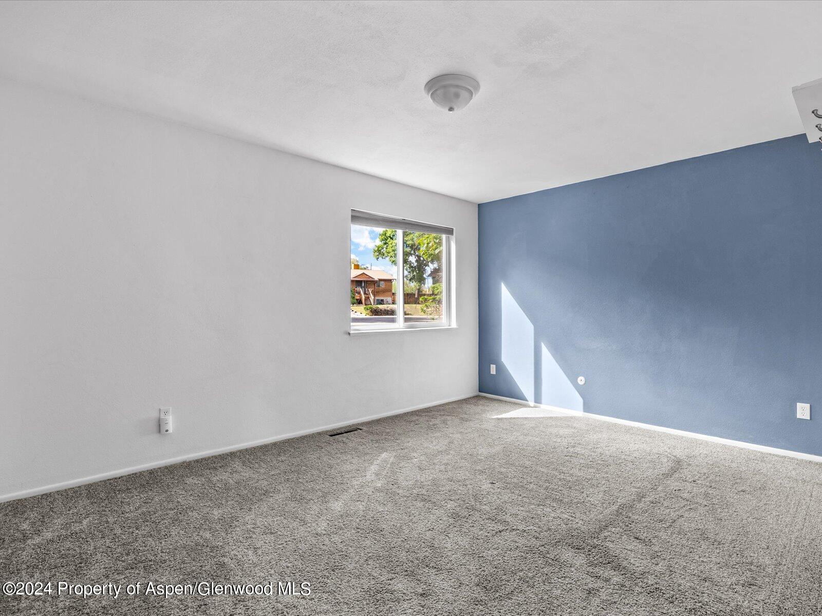 1178 East 8th Street Rifle, CO 81650 - Photo 11 of 28 a view of an empty room with a window