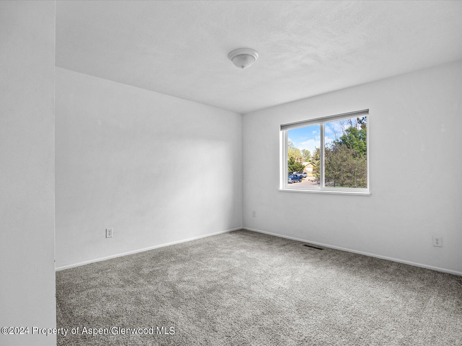 1178 East 8th Street Rifle, CO 81650 - Photo 15 of 28 an empty room with windows