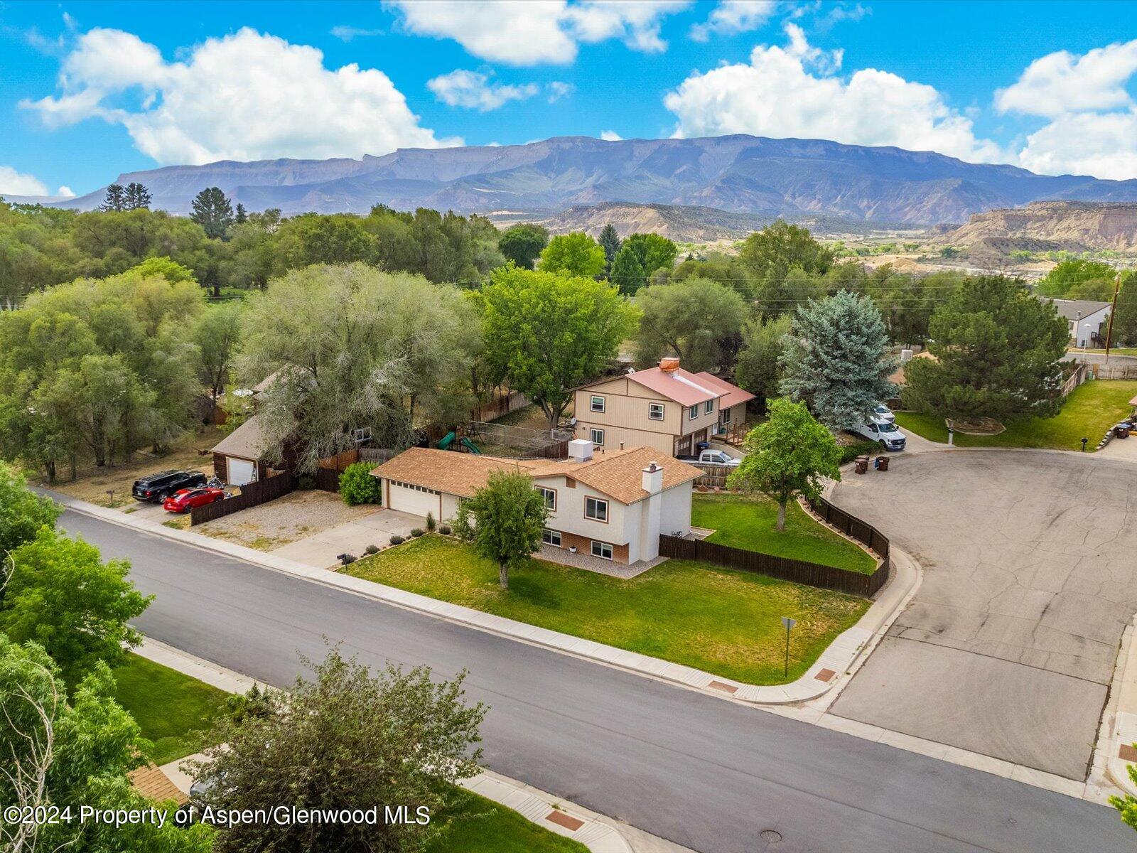 1178 East 8th Street Rifle, CO 81650 - Photo 2 of 28 an aerial view of a house with a garden and a yard