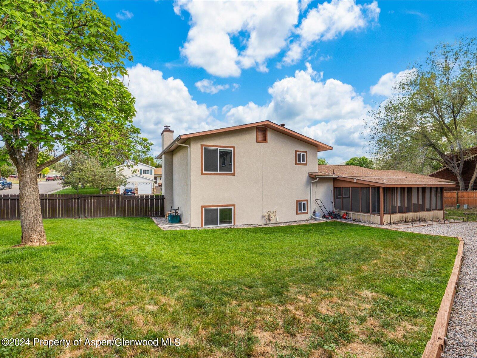 1178 East 8th Street Rifle, CO 81650 - Photo 23 of 28 a view of a house with a yard