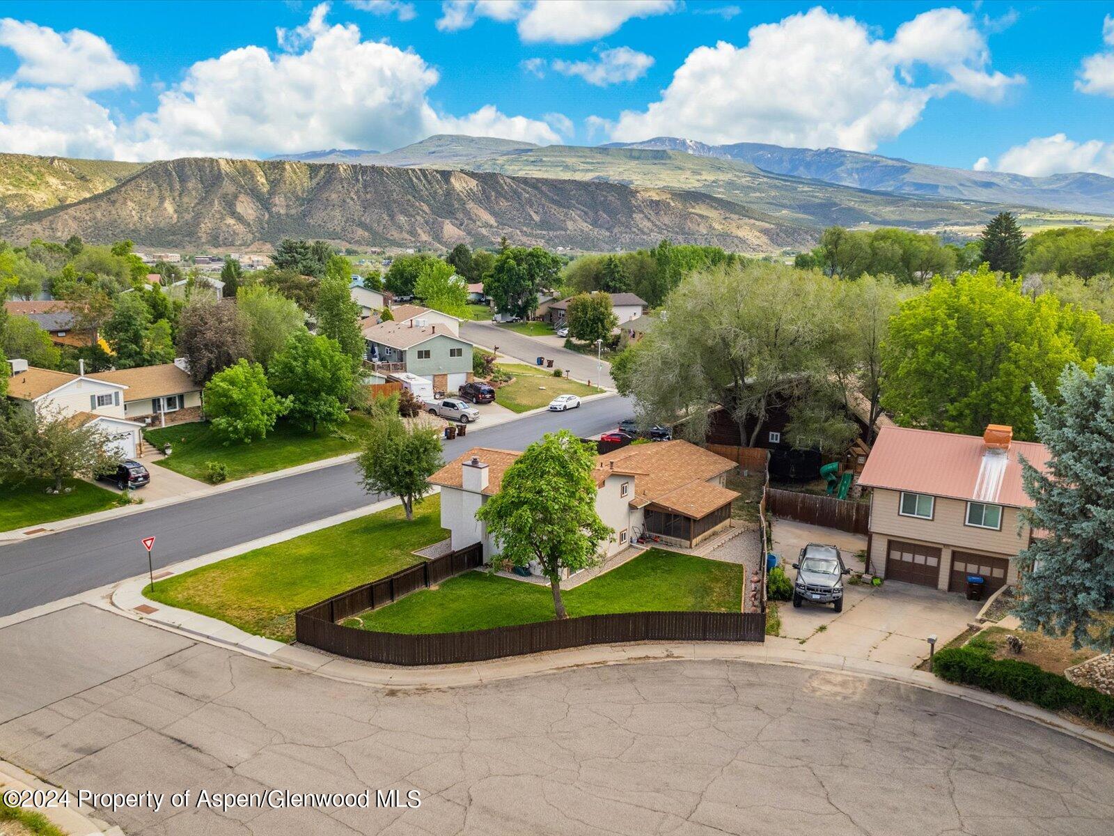 1178 East 8th Street Rifle, CO 81650 - Photo 3 of 28 a view of a terrace with a garden and outdoor seating