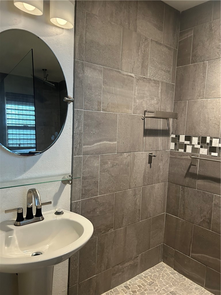 4530 Windows Drive Corpus Christi, TX 78413 - Photo 5 of 11 a bathroom with a sink and a mirror