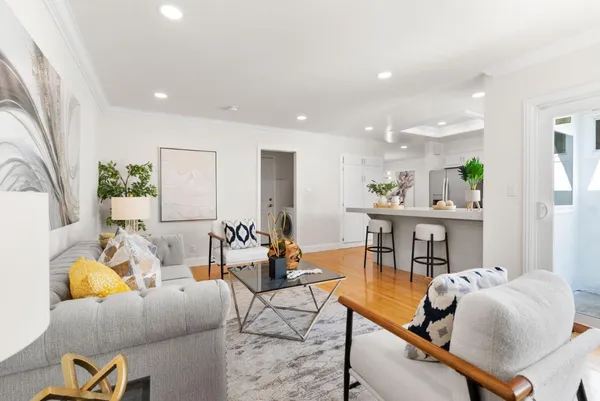 a kitchen with stainless steel appliances a stove a sink and a microwave