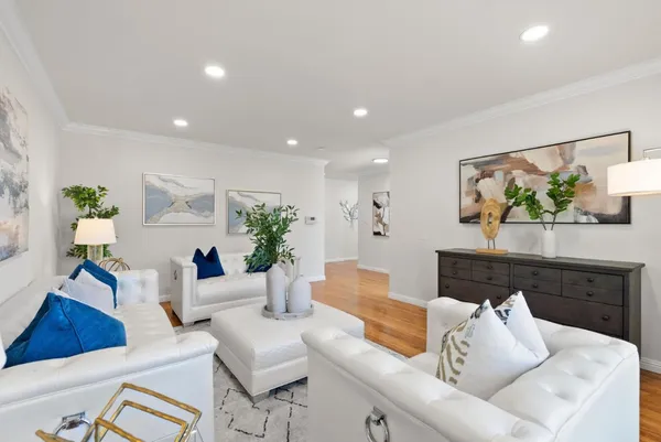 a view of a dining room with furniture window and wooden floor