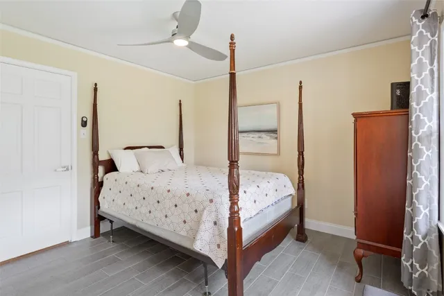 a bed room with a bed and a window