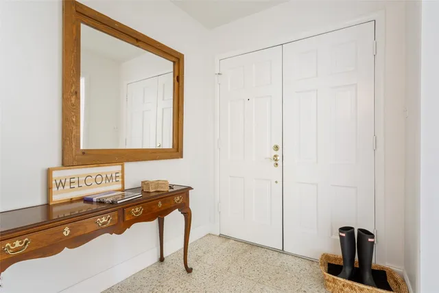 a bathroom with a sink a mirror and shower