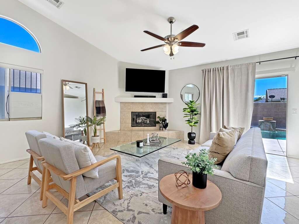 67755 Ontina Road Cathedral City, CA 92234 - Photo 15 of 30 a living room with furniture a flat screen tv and a fireplace