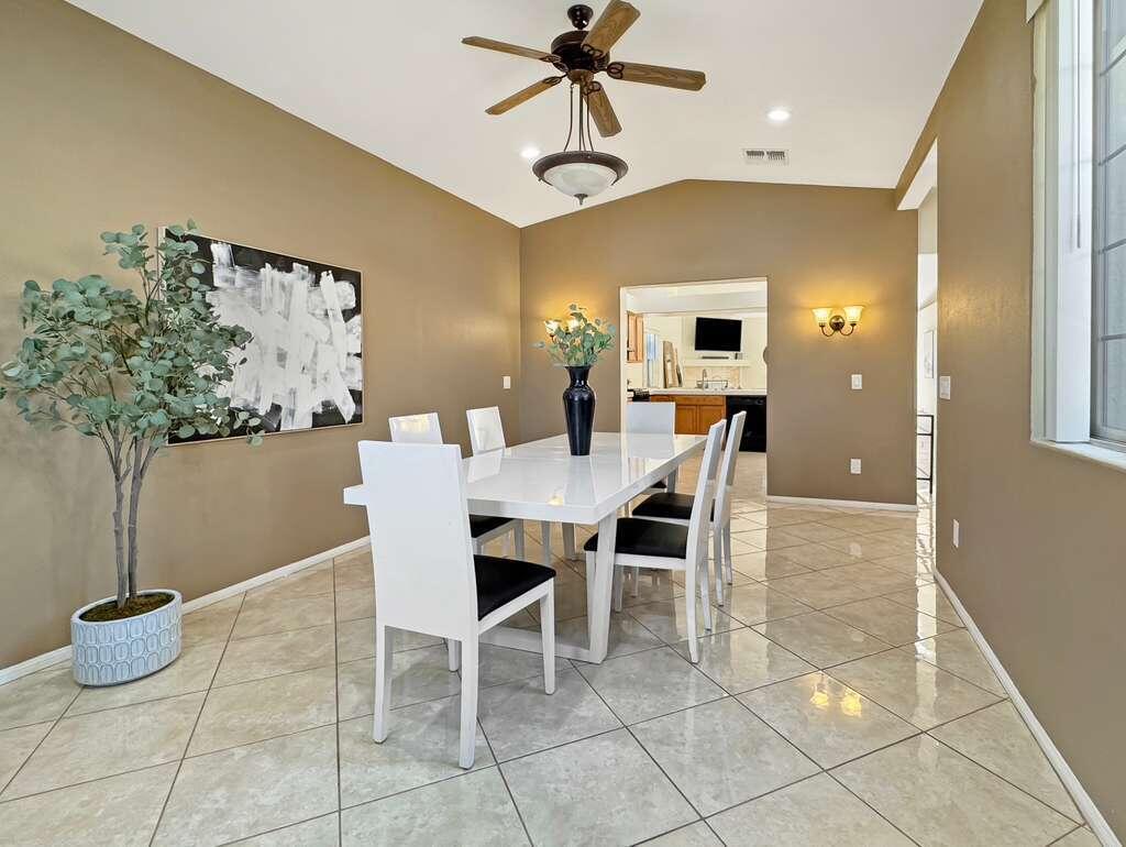 67755 Ontina Road Cathedral City, CA 92234 - Photo 7 of 30 a dining room with chandelier and window