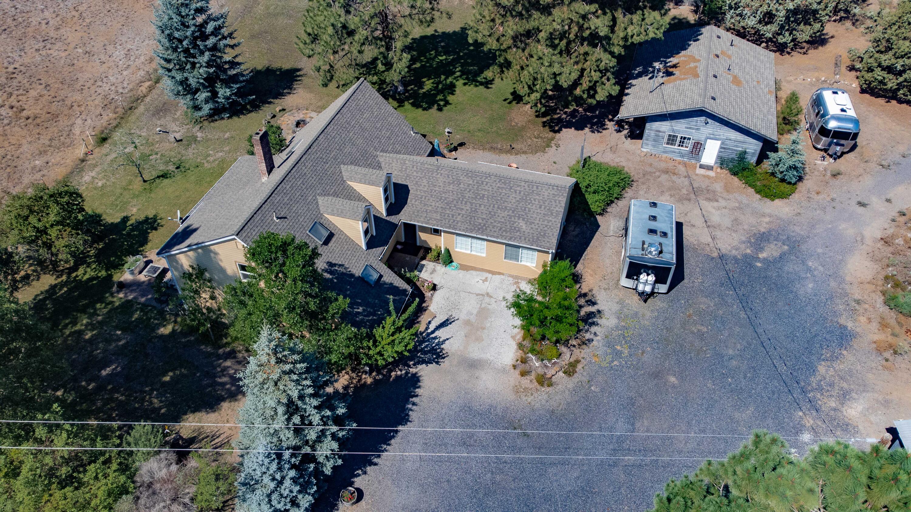 21698 Rickard Road Bend, OR 97702 - Photo 4 of 51 Main home with detached guest house behind it.