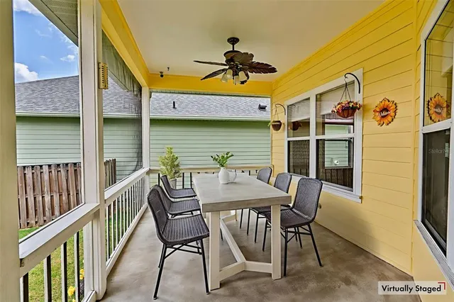 a view of a chairs and table in the balcony