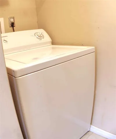 a backyard of a house with potted plants