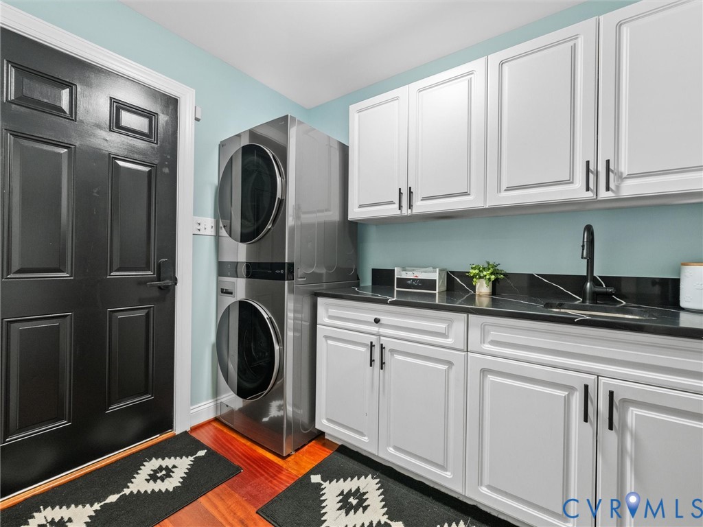 12710 Ivey Mill Road Chesterfield, VA 23838 - Photo 24 of 57 Laundry area with wood-finish flooring, white cabi