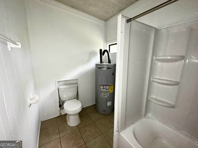 a bathroom with a toilet and a sink