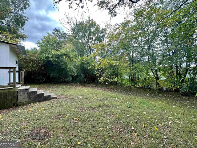a backyard of a house with lots of green space