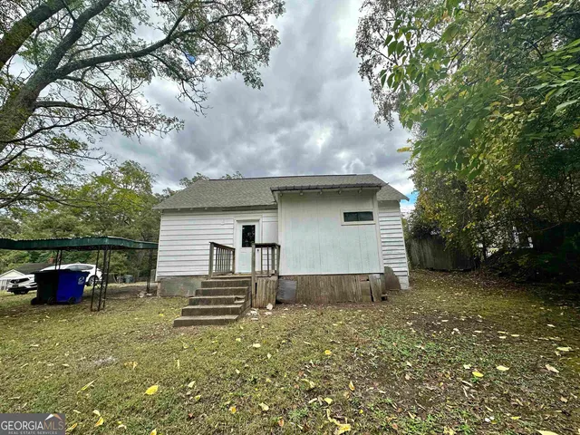 a backyard of a house with oven