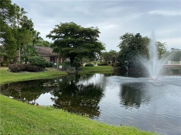a view of a lake with a house in the background