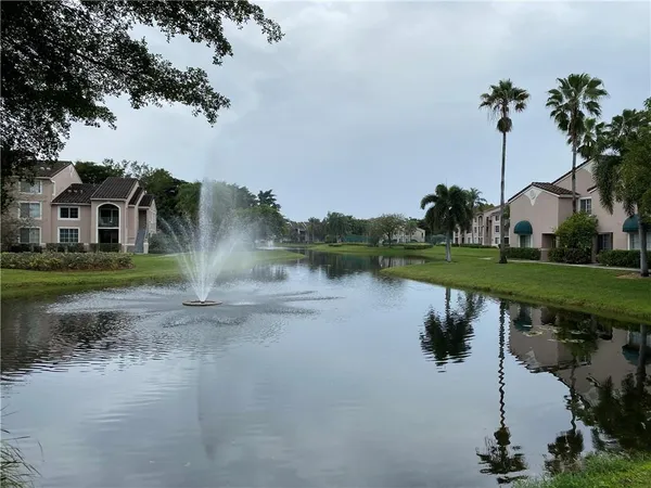 a view of a lake with a house in the background