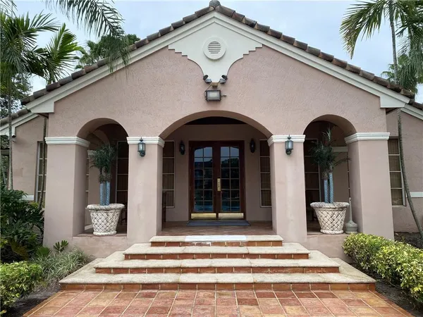 a view of a backyard with sitting area