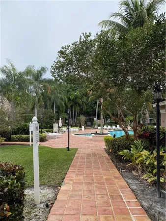 a view of a backyard with swimming pool