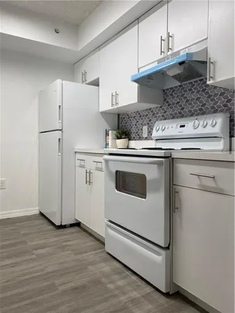 a kitchen with appliances and cabinets