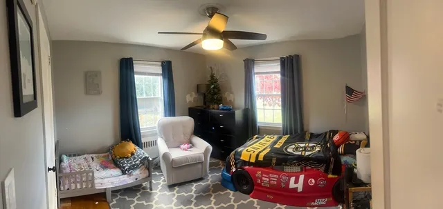 a bedroom with furniture and a chandelier