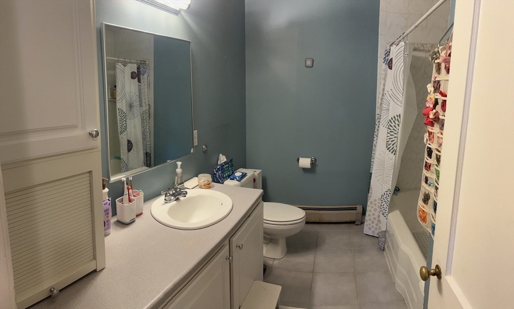 43 Birchland Avenue Springfield, MA 01119 - Photo 10 of 18 a bathroom with a sink toilet and shower