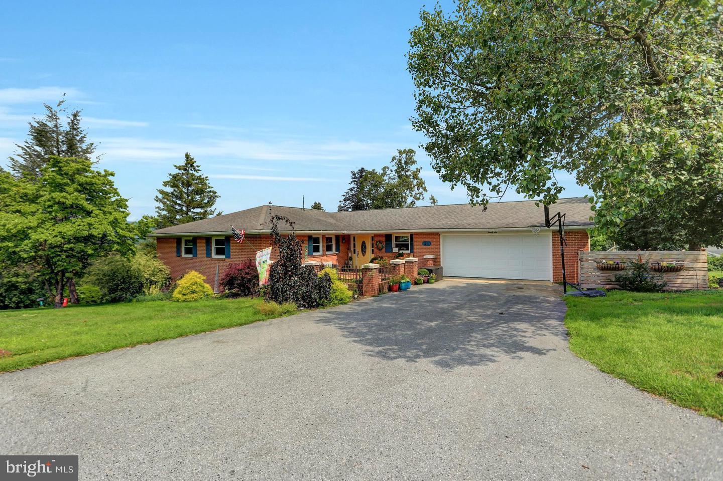 26 Kensington Drive Chambersburg, PA 17201 - Photo 2 of 44 a view of a house with a yard and large tree