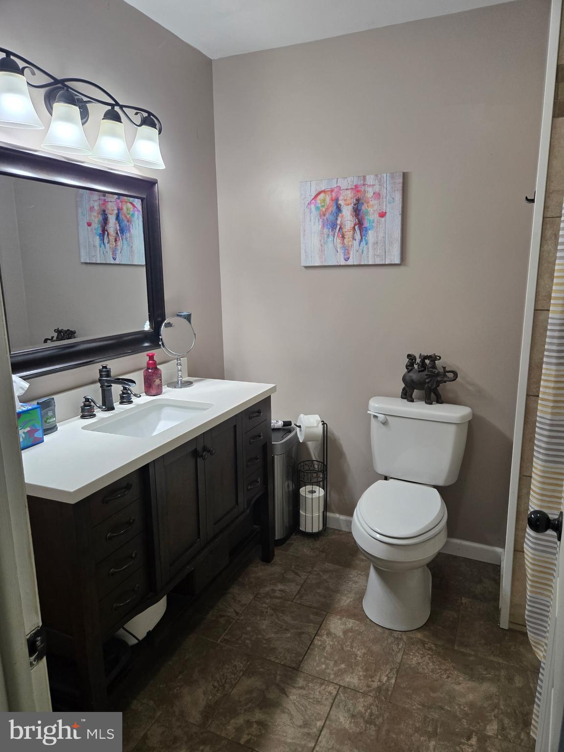 26 Kensington Drive Chambersburg, PA 17201 - Photo 21 of 44 a bathroom with a toilet sink and mirror