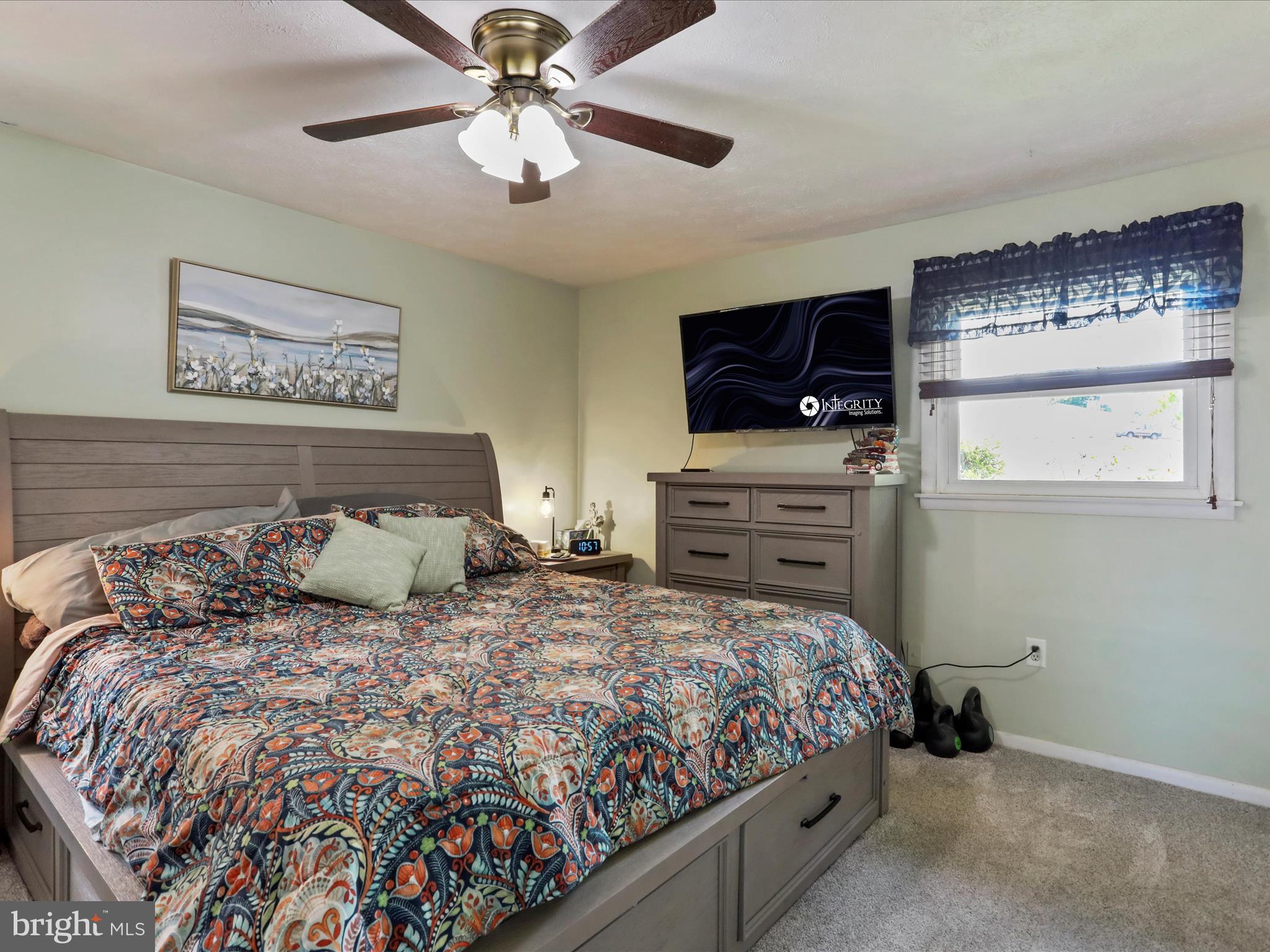 26 Kensington Drive Chambersburg, PA 17201 - Photo 24 of 44 a bedroom with a bed and a flat screen tv