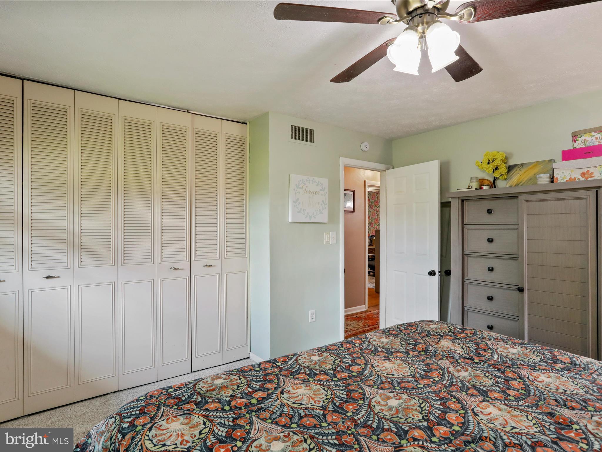 26 Kensington Drive Chambersburg, PA 17201 - Photo 26 of 44 a bedroom with a bed and a chandelier