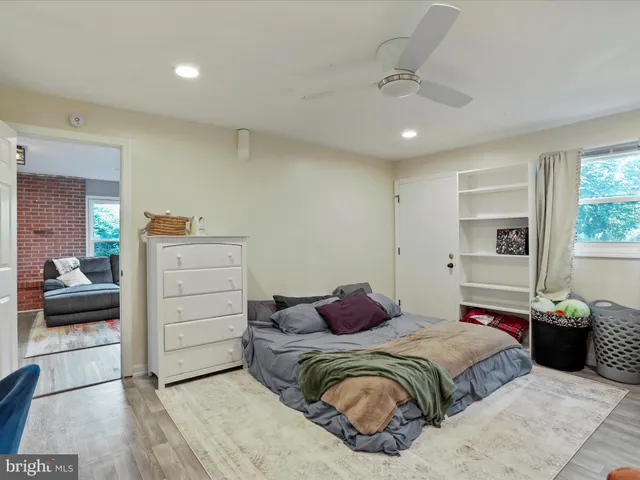 a bedroom with a bed and a view of bedroom