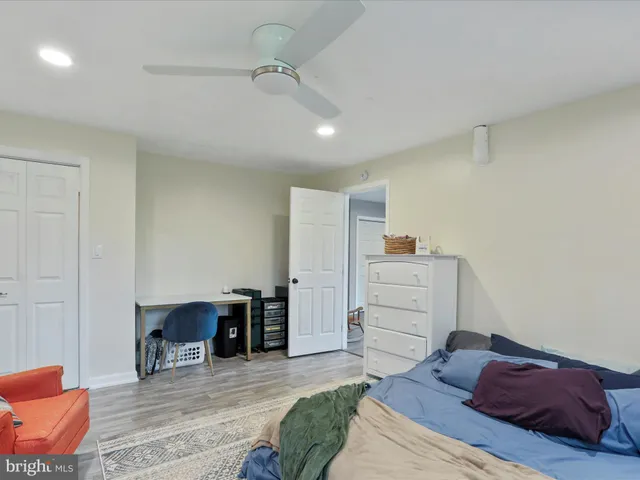 a bedroom with a bed and furniture