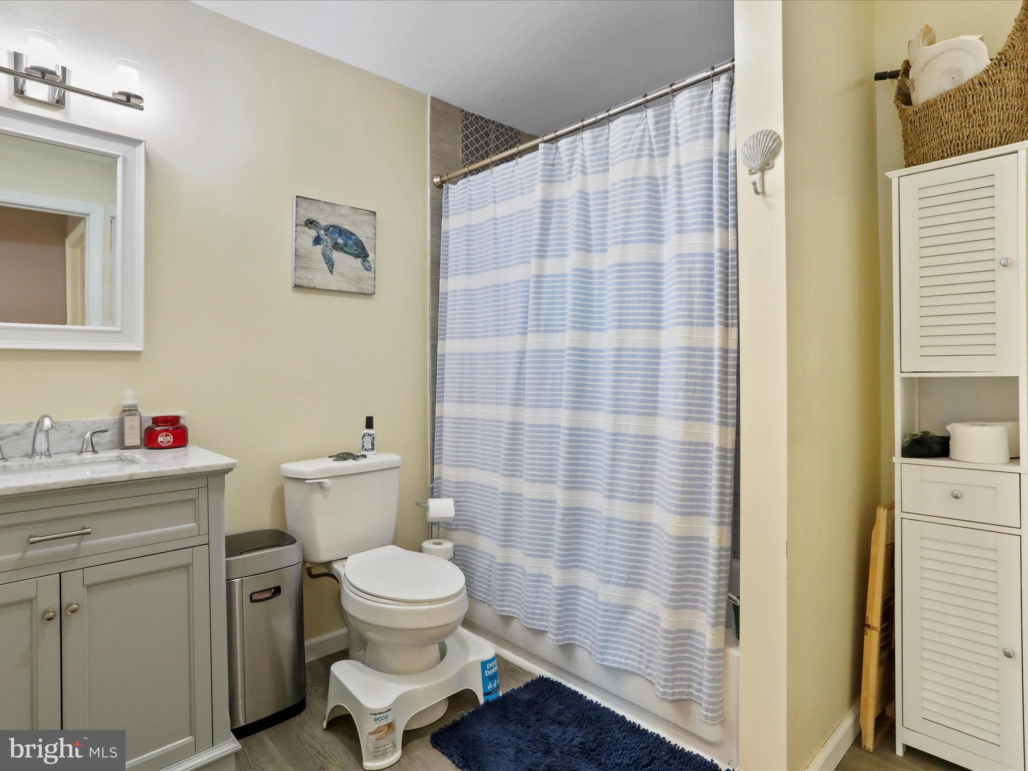 26 Kensington Drive Chambersburg, PA 17201 - Photo 38 of 44 a bathroom with a toilet and a shower curtain