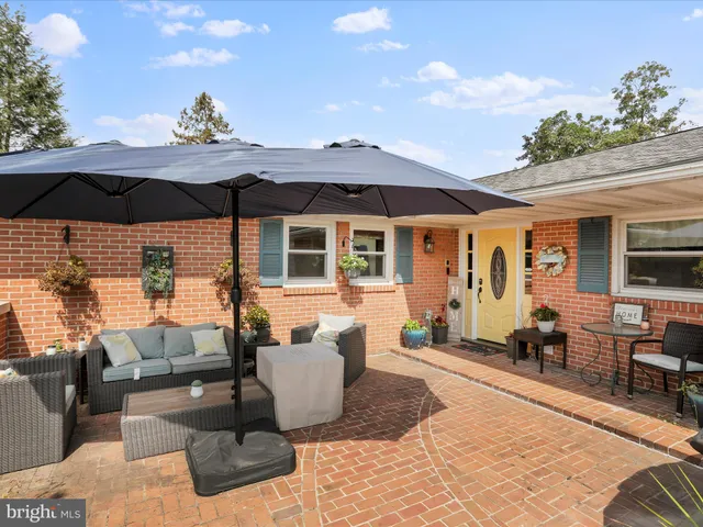 a outdoor space with patio the couches and a potted plant