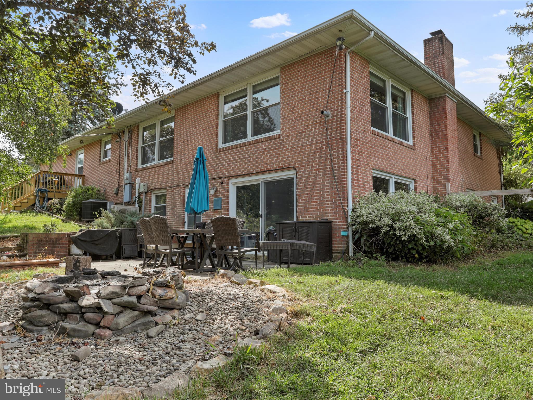 26 Kensington Drive Chambersburg, PA 17201 - Photo 41 of 44 a front view of house with yard outdoor seating and barbeque oven