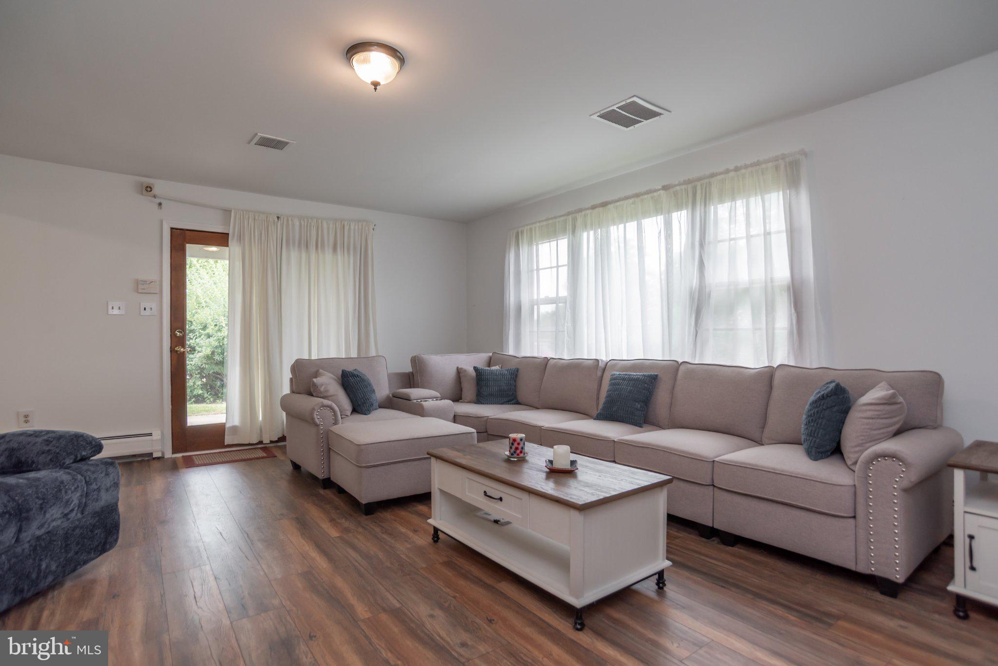 77 Cardinal Road Levittown, PA 19057 - Photo 13 of 37 a living room with furniture and a large window