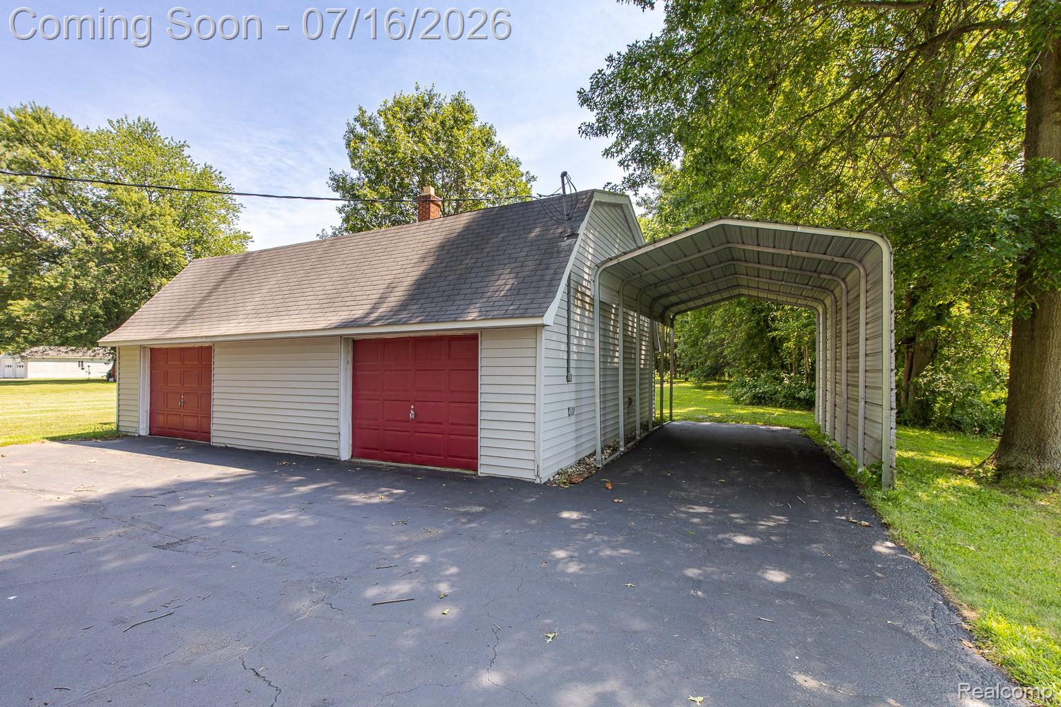 43995 Bemis Road Belleville, MI 48111 - Photo 54 of 67 Oversized garage with a covered RV/boat carport