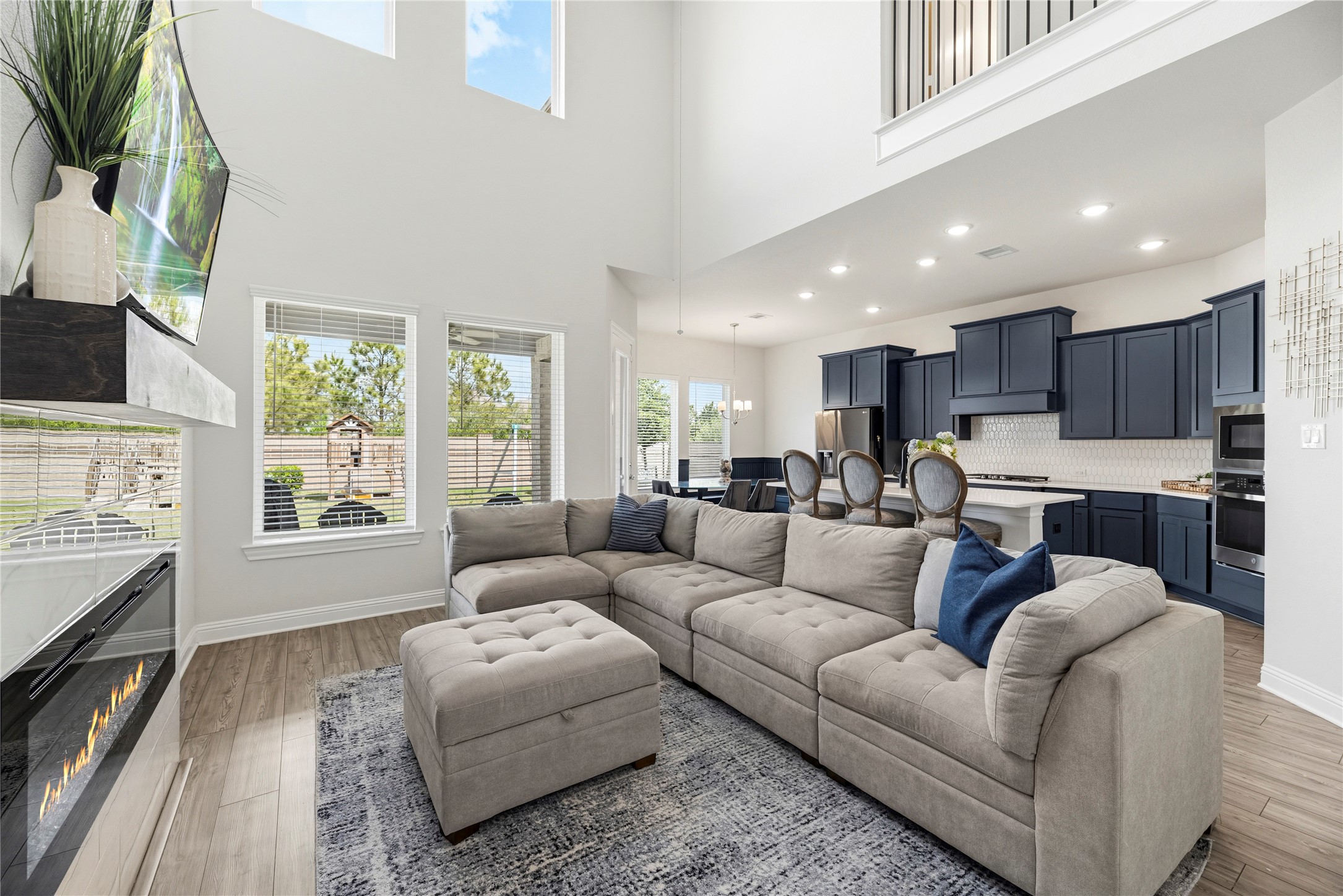 10702 Port Harrison Road Cypress, TX 77433 - Photo 14 of 45 Open concept living area with soaring cielings, plenty of natural light and beautiful views of the tree lined lot.