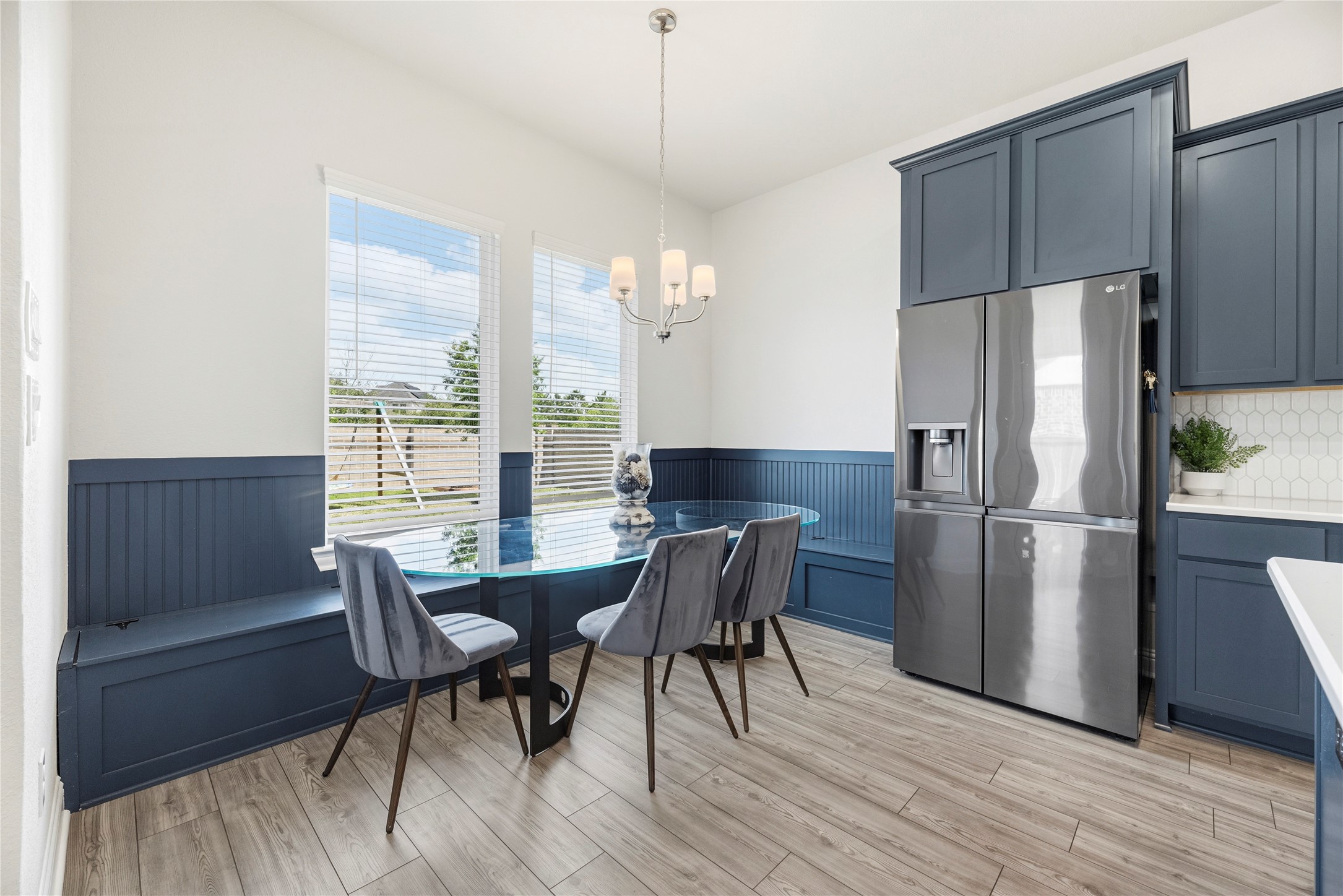 10702 Port Harrison Road Cypress, TX 77433 - Photo 18 of 45 A great use of space for a casual dining room. Extra storage under bench seating and an abundance of natural light.