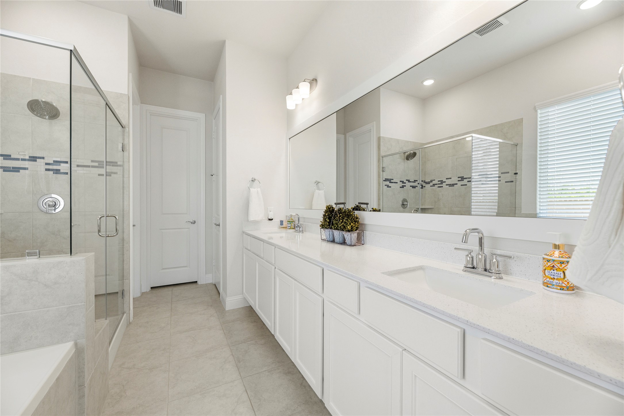10702 Port Harrison Road Cypress, TX 77433 - Photo 21 of 45 Light, bright and airy! The garden styled bath tub and large walk-in shower along with a huge vanity space and double sinks.