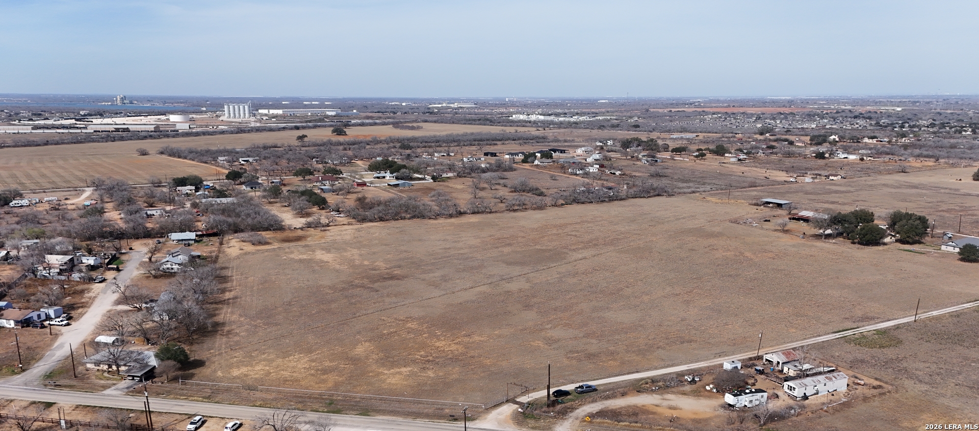 15785 Kilowatt Road Elmendorf, TX 78112 - Photo 6 of 23 an aerial view of a house with a mountain