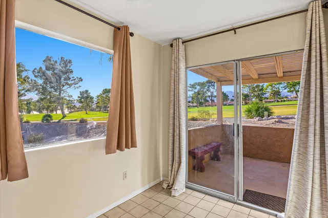 a view of a livingroom with furniture and a potted plant