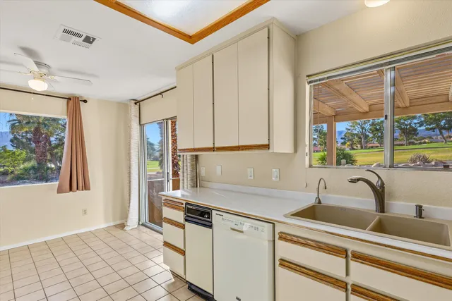 a view of swimming pool with a table and chairs in balcony