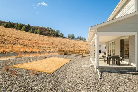 a view of a terrace with wooden floor and lake view
