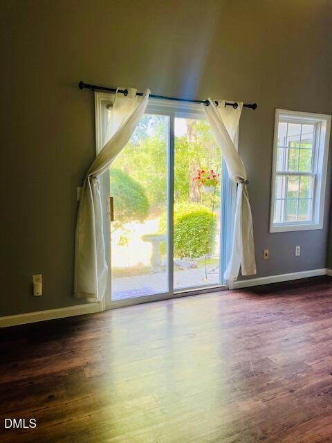 6016 River Lake Circle Raleigh, NC 27604 - Photo 6 of 15 a view of a room with wooden floor and a window