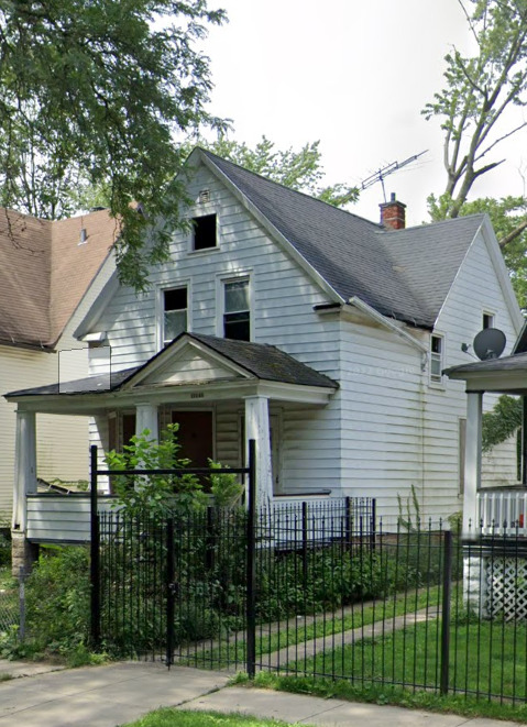 11940 South Yale Avenue Chicago, IL 60628 - Photo 2 of 22 a front view of a house with a garden