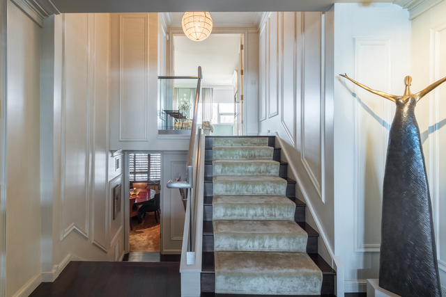 1630 Sheridan Road, Unit 4EF Wilmette, IL 60091 - Photo 13 of 25 a view of staircase with white walls and wooden floor