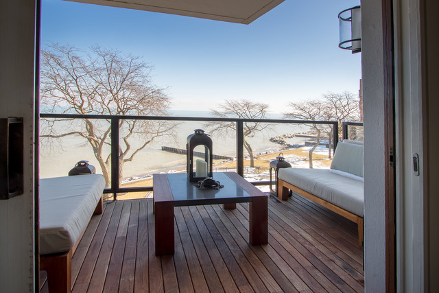 1630 Sheridan Road, Unit 4EF Wilmette, IL 60091 - Photo 24 of 25 a view of a balcony with furniture and wooden floor
