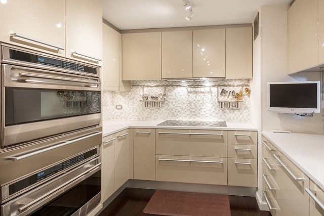1630 Sheridan Road, Unit 4EF Wilmette, IL 60091 - Photo 10 of 25 a kitchen with kitchen island stainless steel appliances and cabinets